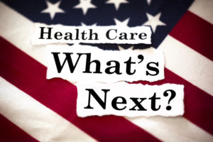 The words "Health Care What's Next?" with an American flag in the background.